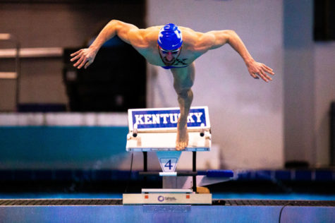 Kentucky senior Wyatt Amdor leaps into the pool for the mens 100 yard breaststroke during the meet against the University of Cincinnati on Friday, Jan. 31, 2020, at the Lancaster Aquatic Center in Lexington, Kentucky. Photo by Jordan Prather | Staff