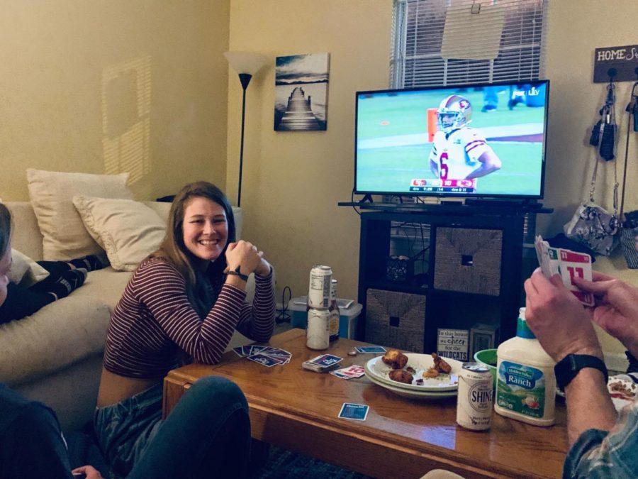 Brianna Stanley stares lovingly in the direction of the artichoke dip while watching Super Bowl LIV. Photo provided by Brianna Stanley.