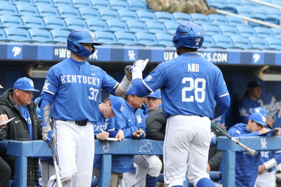 Junior outfielder Oraj Anu fist bumps sophomore outfielder Cam Hill during the game against Southeastern Missouri State on Tuesday, February 18, 2020 in Lexington, Ky. Photo by Chase Phillips | Staff