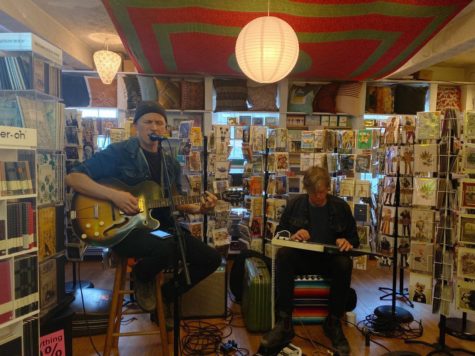 Warren Byron, left, and Chris Sullivan, right, perform for sQecial Medias 48th anniversary celebration amidst the stores unique stock. Photo by Gillian Stawiszynski