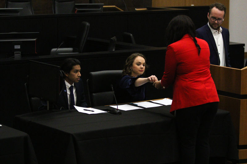 SGA presidential candidate Courtney Wheeler and her running mate Bilal Shaikh (far left) prepare to speak during the President and Vice President Debate on Wednesday, Feb. 26, 2020, at UK College of Law Grand Courtroom in Lexington, Kentucky. Photo by Luke Taylor | Staff
