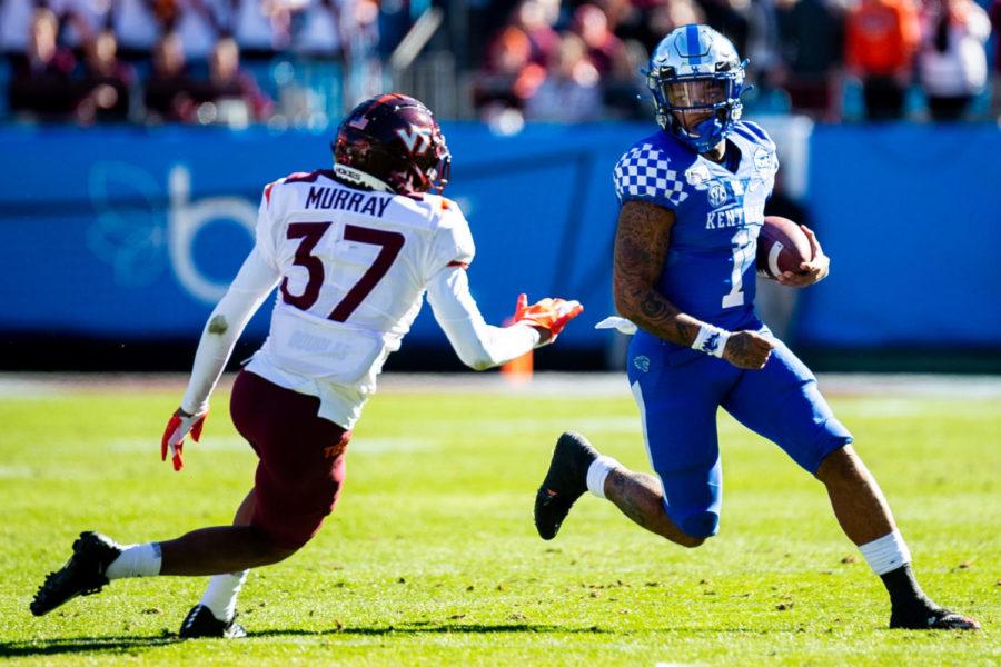 Kentucky Wildcats quarterback Lynn Bowden Jr. (1) runs the ball down the field during the Belk Bowl football game between Kentucky and Virginia Tech on Tuesday, Dec. 31, 2019, at Bank of America Stadium in Charlotte, North Carolina. UK won 37-30. Photo by Michael Clubb | Staff