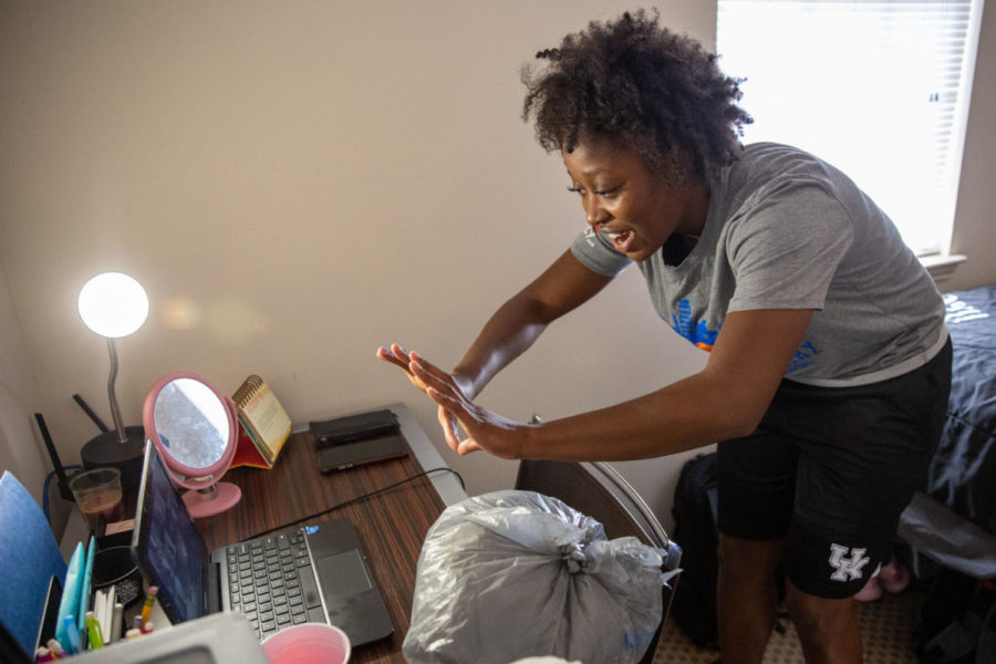 Kameron Roach demonstrates the proper form to set a ball on Friday, Nov. 6, 2020, at her apartment in Lexington, Kentucky. Photo by Jack Weaver | Staff