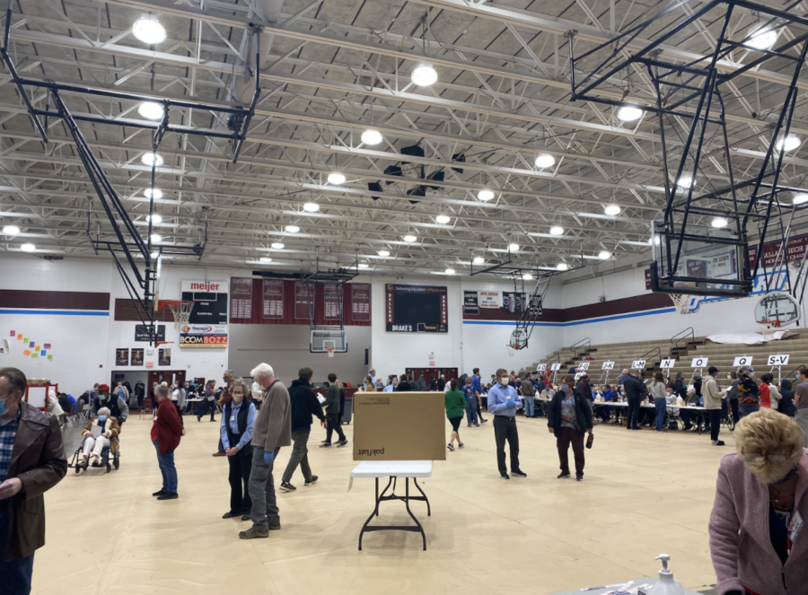 Voters spread out in the gym of Ballard High School, a voting location in Louisville, Kentucky, as they cast their votes on Election Day, Nov. 3., 2020. Photo by Clare Egan.