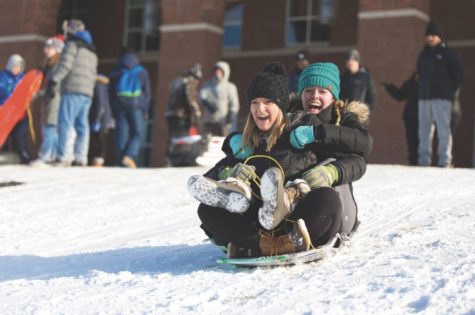 Students take part in the tradition of sledding in front of William T. Young Library on January 16, 2018, at the University of Kentucky. Photo by Jordan Prather.