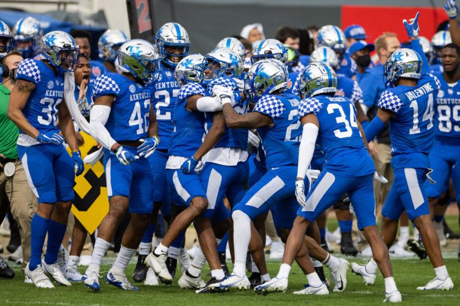 Kentucky Wildcats defensive back Brandin Echols (26) celebrates with his team after picking off a NC State pass during the University of Kentucky vs. North Carolina State TaxSlayer Gator Bowl game on Saturday, Jan. 2, 2021, at TIAA Bank Field in Jacksonville, Florida. Kentucky won 23-21. Photo by Michael Clubb | Staff
