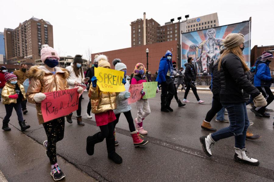 Young participants hold up signs during the annual Holiday Freedom March on Monday, Jan. 18, 2021, in Lexington, Kentucky. Photo by Michael Clubb | Staff