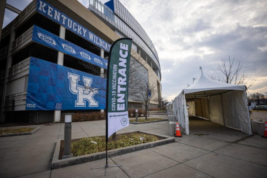 A flag signals the entrance of the COVID-19 vaccine clinic in the Central Bank Club on Tuesday, Jan. 19, 2021, at Kroger Field in Lexington, Kentucky. Photo by Michael Clubb | Staff