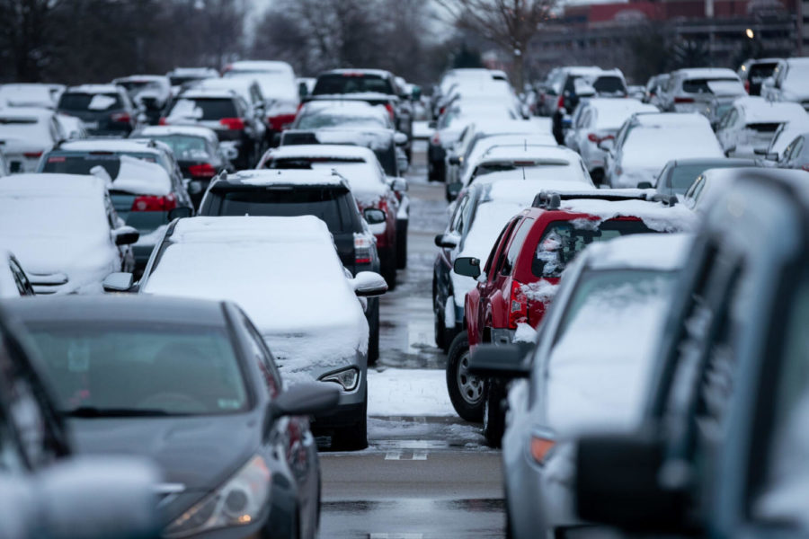 Snow covers cars parked in the student parking lot outside Kroger Field on Thursday, Jan. 28, 2021, at the University of Kentucky in Lexington, Kentucky. Photo by Michael Clubb | Staff.