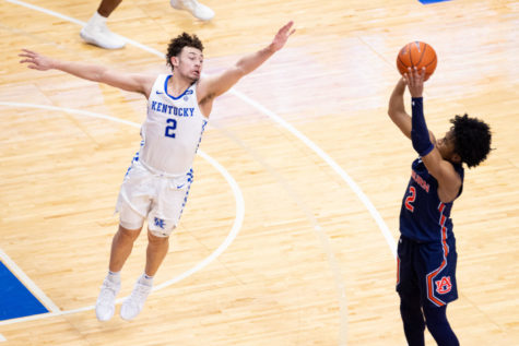 Kentucky Wildcats guard Devin Askew (2) tries to block a shot during the University of Kentucky vs. Auburn mens basketball game on Saturday, Feb. 13, 2021, at Rupp Arena in Lexington, Kentucky. UK won 82-80. Photo by Michael Clubb | Staff