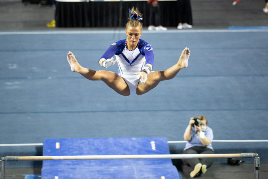 Josie Angeny preforms her bars routine during the University of Kentucky vs. Arkansas gymnastics meet on Friday, Feb. 12, 2021, at Memorial Coliseum in Lexington, Kentucky. UK won 197.000-196.675. Photo by Michael Clubb | Staff