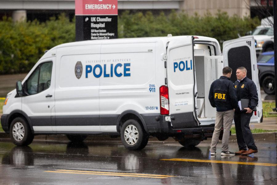 A FBI and ATF agent talk with each other during an emergency situation on Thursday, March 25, 2021, at UK Chandler Hospital in Lexington, Kentucky. Photo by Michael Clubb | Staff
