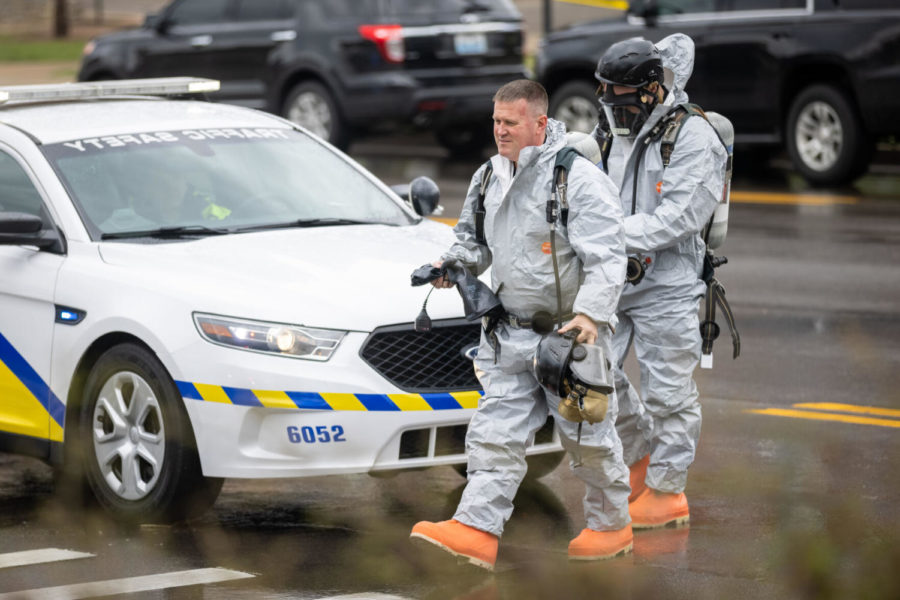 Firemen wearing hazmat suits exit the hospital during an emergency situation on Thursday, March 25, 2021, at UK Chandler Hospital in Lexington, Kentucky. Photo by Michael Clubb | Staff