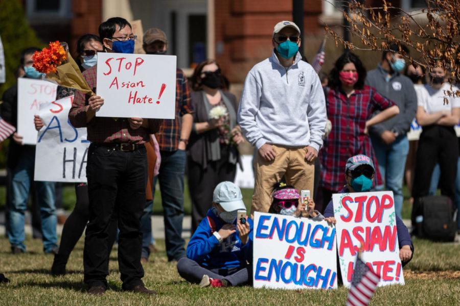 Participants listen to a speaker during a Stop Asian Hate rally on Wednesday, March 24, 2021, at the lawn in front of Memorial Hall in Lexington, Kentucky. Photo by Michael Clubb | Staff