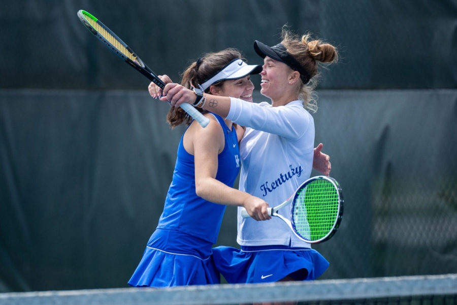 Akvil%C4%97+Para%C5%BEinskait%C4%97+%28right%29+hugs+Fiona+Arrese+%28left%29+after+wing+their+doubles+match+during+the+University+of+Kentucky+vs.+Tennessee+women%E2%80%99s+tennis+match+on+Sunday%2C+March+28%2C+2021%2C+at+Hillary+J.+Boone+Tennis+Center+in+Lexington%2C+Kentucky.+Photo+by+Michael+Clubb+%7C+Staff
