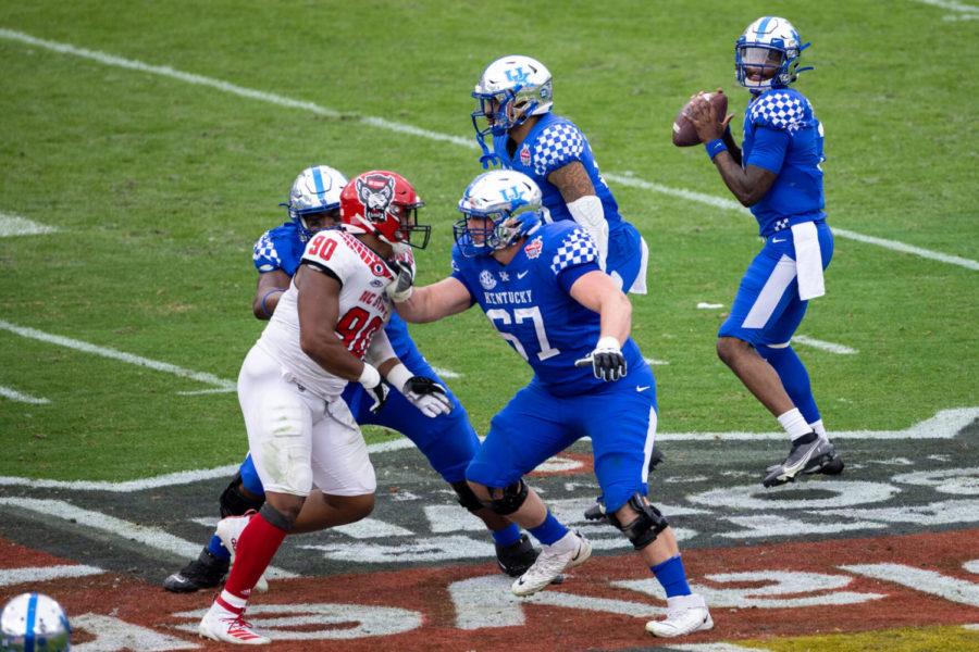 Kentucky+Wildcats+quarterback+Terry+Wilson+%283%29+looks+for+an+open+receiver+during+the+University+of+Kentucky+vs.+North+Carolina+State+TaxSlayer+Gator+Bowl+game+on+Saturday%2C+Jan.+2%2C+2021%2C+at+TIAA+Bank+Field+in+Jacksonville%2C+Florida.+Kentucky+won+23-21.+Photo+by+Michael+Clubb+%7C+Staff