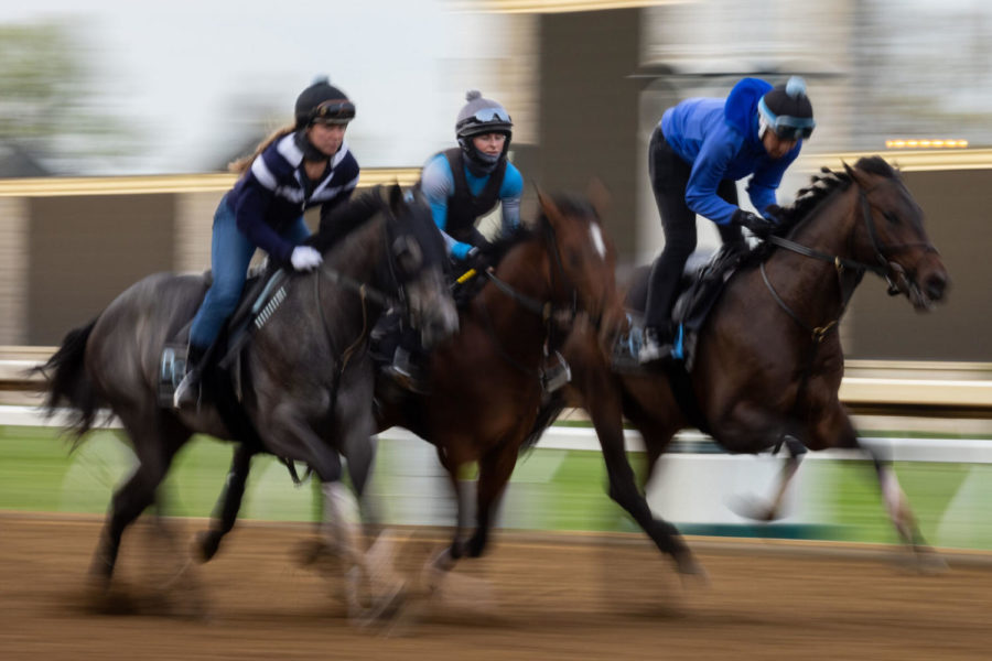 Horses run down the track during morning workouts on Saturday, April 10, 2021, at Keeneland in Lexington, Kentucky. Photo by Michael Clubb | Staff