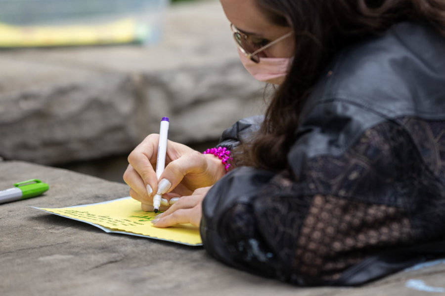 Participants fill out cards during the Artivism For Autism event held by LPD Accountability on Saturday, April 17, 2021, at the Courthouse Plaza in Lexington, Kentucky. Photo by Michael Clubb | Staff
