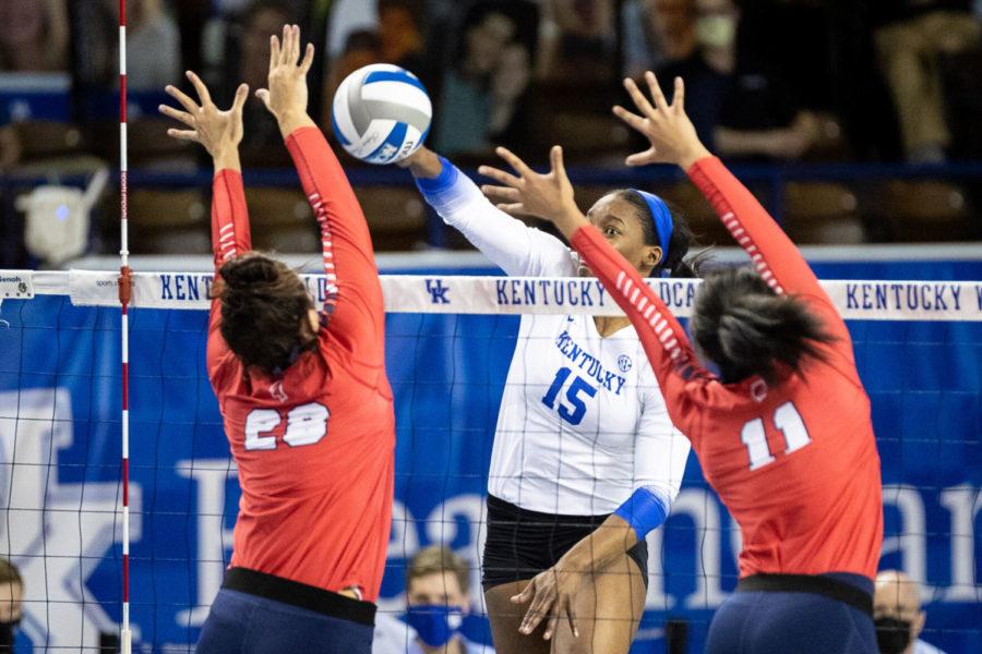 Kentucky Wildcats opposite Azhani Tealer (15) spikes the ball during the UK vs. Ole Miss volleyball game on Friday, March 12, 2021, at Memorial Coliseum in Lexington, Kentucky. UK won 3-0. Photo by Michael Clubb | Staff