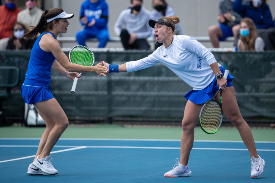 Akvilė Paražinskaitė (right) high fives Fiona Arrese (left) after a game winning point during the University of Kentucky vs. Tennessee women’s tennis match on Sunday, March 28, 2021, at Hillary J. Boone Tennis Center in Lexington, Kentucky. Photo by Michael Clubb | Staff