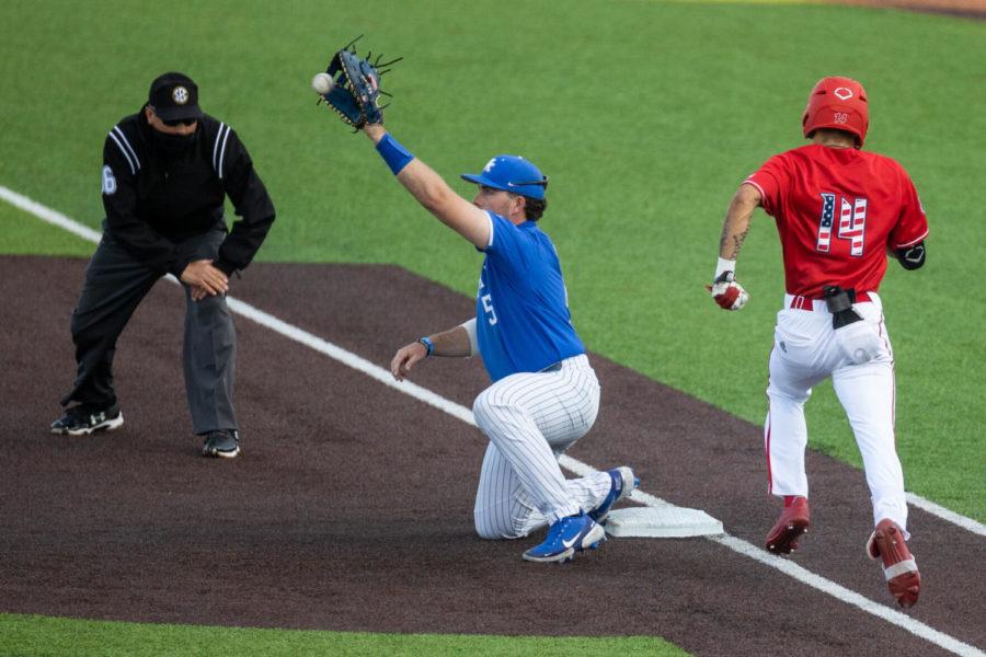 Kentucky Wildcat T.J. Collett (5) catches the ball at first base during the UK vs. Louisville baseball game on Tuesday, April 20, 2021, at Kentucky Proud Park in Lexington, Kentucky. UK lost 12-5. Photo by Jack Weaver | Staff