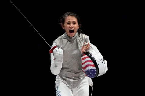 Team USAs Lee Kiefer celebrates after she defeated Inna Deriglazova of the Russian Olympic Committee 15-13 for the gold medal of the womens individual foil fencing event at the Tokyo 2020 Olympics.