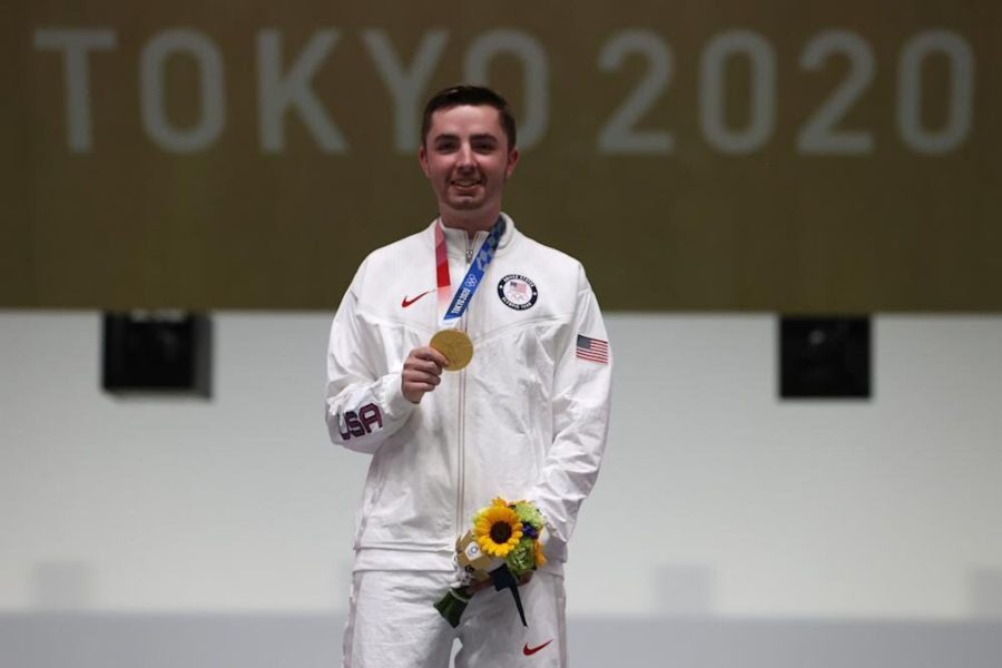 Gold medalist and Olympic record holder William Shaner of the United States stands on the podium after winning the mens 10-meter air rifle on Sunday in Asaka, Japan.