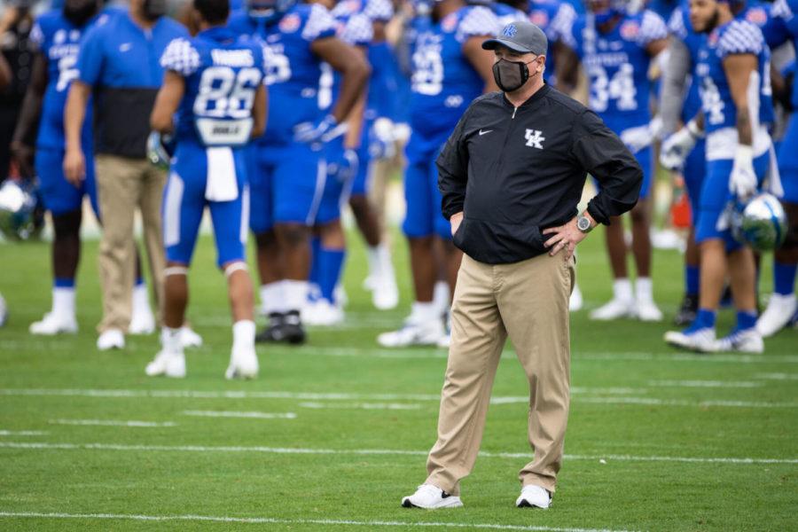 Kentucky+Wildcats+head+coach+Mark+Stoops+watches+his+team+warmup+before+the+University+of+Kentucky+vs.+North+Carolina+State+TaxSlayer+Gator+Bowl+game+on+Saturday%2C+Jan.+2%2C+2021%2C+at+TIAA+Bank+Field+in+Jacksonville%2C+Florida.+Kentucky+won+23-21.+Photo+by+Michael+Clubb+%7C+Staff