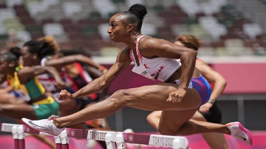 Jasmine Camacho-Quinn, of Puerto Rico, runs in her heat of the womens 100-meter hurdles at the 2020 Summer Olympics, Saturday, July 31, 2021, in Tokyo. (AP Photo/David J. Phillip)