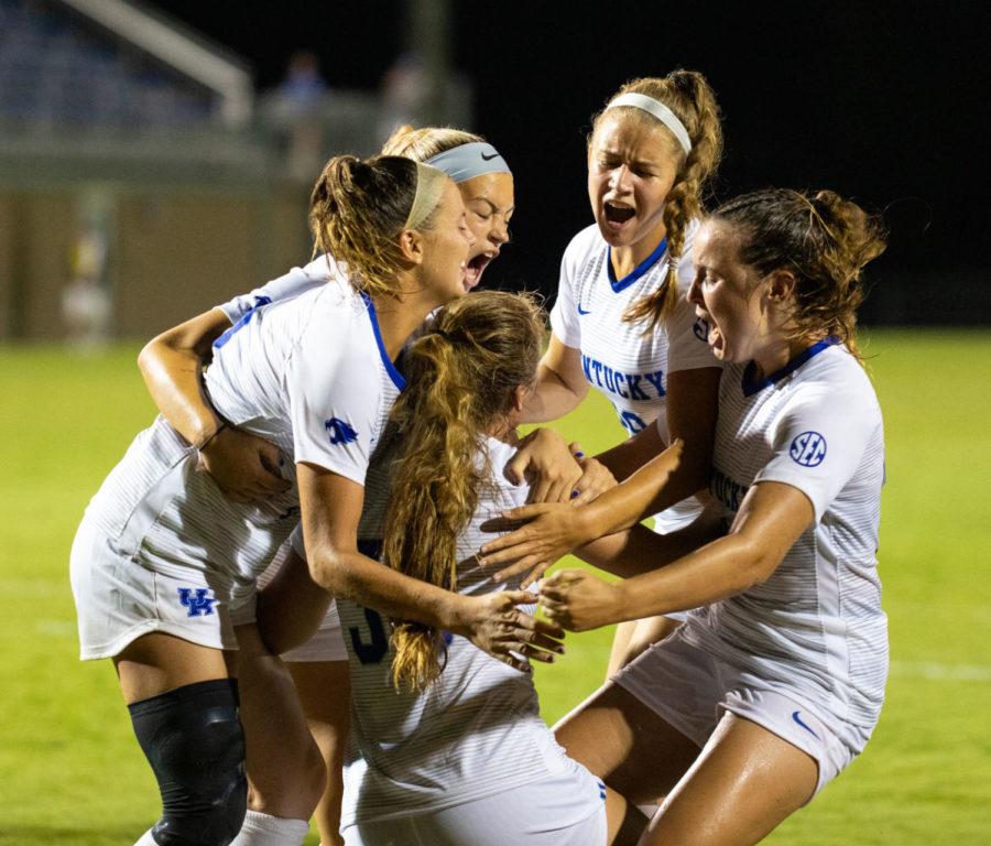 Kentucky womens soccer players celebrate a point during the game against Western Bowling Green State University on Thursday, Aug. 22, 2019, at the Bell Soccer Complex in Lexington, Kentucky. The game ended in a tie with a score of 3-3. Photo by Jordan Prather | Staff