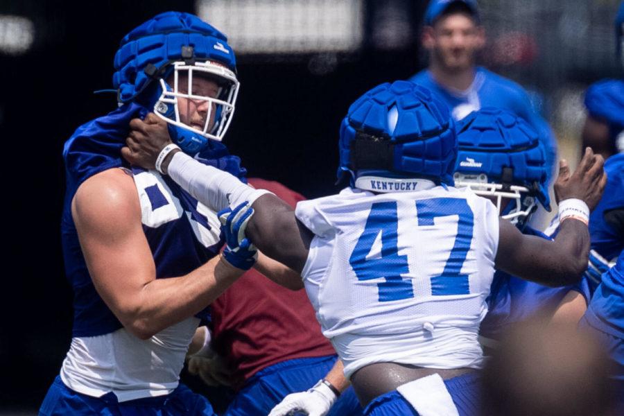 Justin Rigg (83) blocks a defender during the UK football Fan Day open practice on Saturday, Aug. 7, 2021, at Kroger Field in Lexington, Kentucky. Photo by Michael Clubb | Staff
