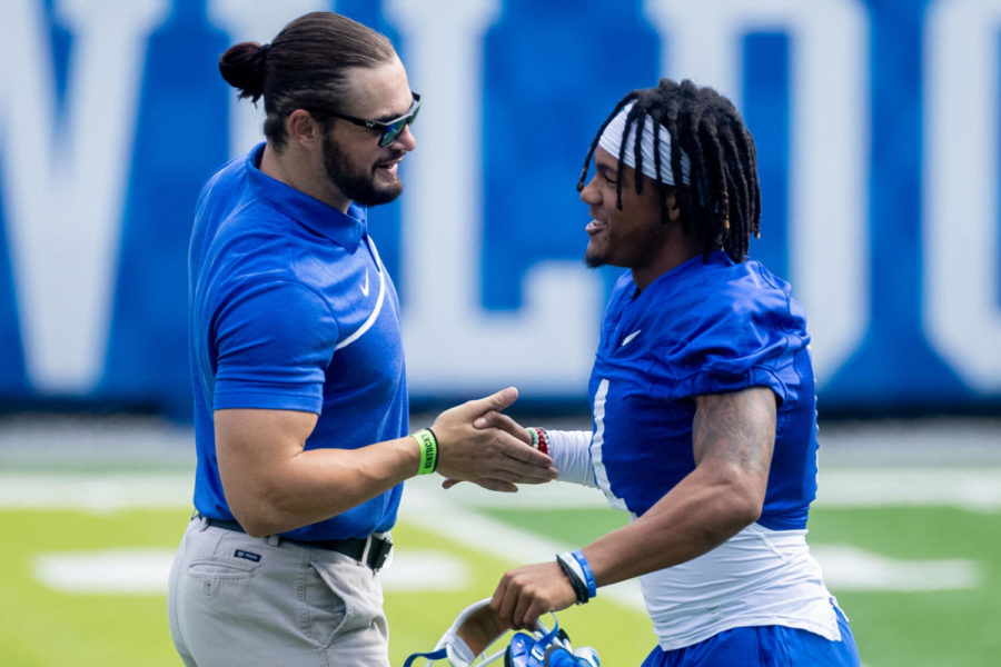 Former+Kentucky+football+player+Kash+Daniel+%28left%29+and+wide+receiver+Wan%E2%80%99dale+Robinson+%28right%29+high+five+each+other+during+the+UK+football+Fan+Day+open+practice+on+Saturday%2C+Aug.+7%2C+2021%2C+at+Kroger+Field+in+Lexington%2C+Kentucky.+Photo+by+Michael+Clubb+%7C+Staff