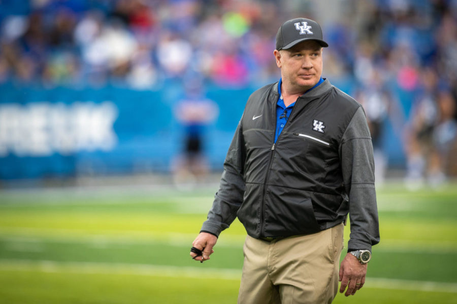 Kentucky Wildcats head coach Mark Stoops looks off to one of his players. University of Kentucky’s football team played their annual spring game on Friday, April 12, 2019 at Kroger Field. The Blue team won 64-10. Photo by Michael Clubb | Staff