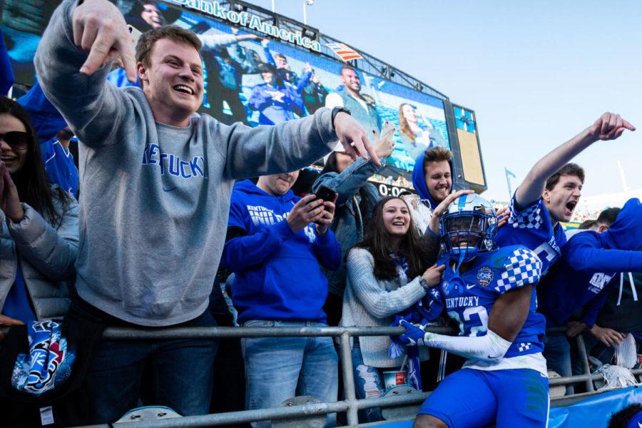 Kentucky+Wildcats+linebacker+Chris+Oats+%2822%29+celebrates+with+fans+after+the+Belk+Bowl+football+game+between+Kentucky+and+Virginia+Tech+on+Tuesday%2C+Dec.+31%2C+2019%2C+at+Bank+of+America+Stadium+in+Charlotte%2C+North+Carolina.+UK+won+37-30.+Photo+by+Michael+Clubb+%7C+Staff