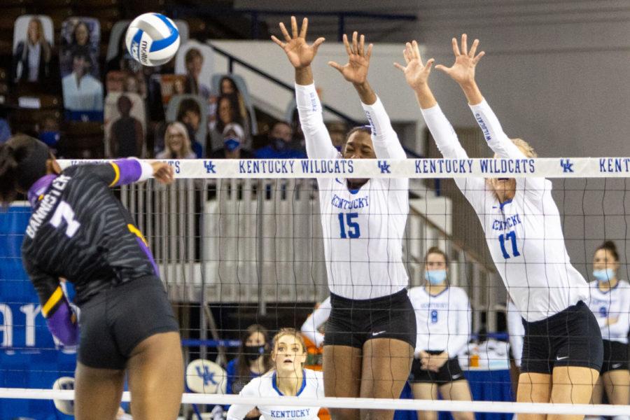 Kentucky Wildcats opposite Azhani Tealer (15) closes her eyes while blocking the ball during the UK vs. Louisiana State University game on Friday, March 5, 2021, at Memorial Coliseum in Lexington, Kentucky. UK won 3-0. Photo by Jack Weaver | Staff