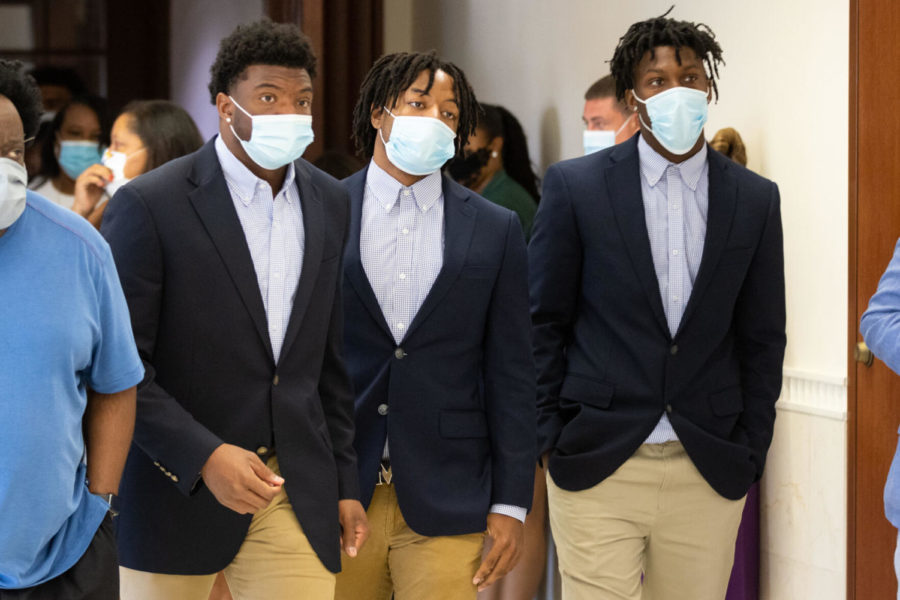 Kentucky football players Earnest Sanders IV, JuTahn McClain, and Joel Williams (left to right) leave the Fayette County District Courthouse after their preliminary hearing on Wednesday, Aug. 25, 2021, in downtown Lexington, Kentucky. Photo by Michael Clubb | Staff