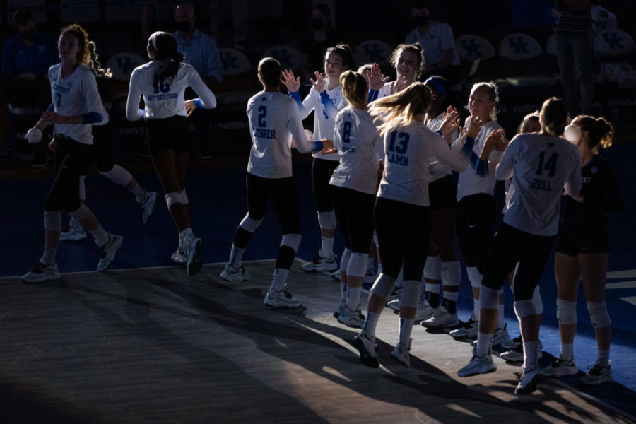 The Wildcats high five each other after being introduced before UK volleyball’s game against Southern California on Saturday, Sept. 4, 2021, at Memorial Coliseum in Lexington, Kentucky. UK won 3-0. Photo by Jack Weaver | Staff
