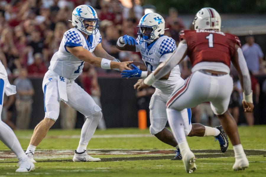 Kentucky quarterback Will Levis (7) hands the ball off to Kentucky running back Kavosiey Smoke (0) during the University of Kentucky vs. South Carolina football game on Saturday, Sept. 25, 2021, at Williams-Brice Stadium in Columbia, South Carolina. UK won 16-10. Photo by Jack Weaver | Staff