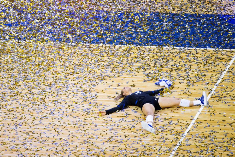 Kentucky Wildcats libero Gabby Curry (12) makes confetti angels after the University of Kentucky vs. Texas NCAA women’s volleyball championship game on Saturday, April 24, 2021, at CHI Health Center in Omaha, Nebraska. UK won 3-1. Photo by Michael Clubb | Staff