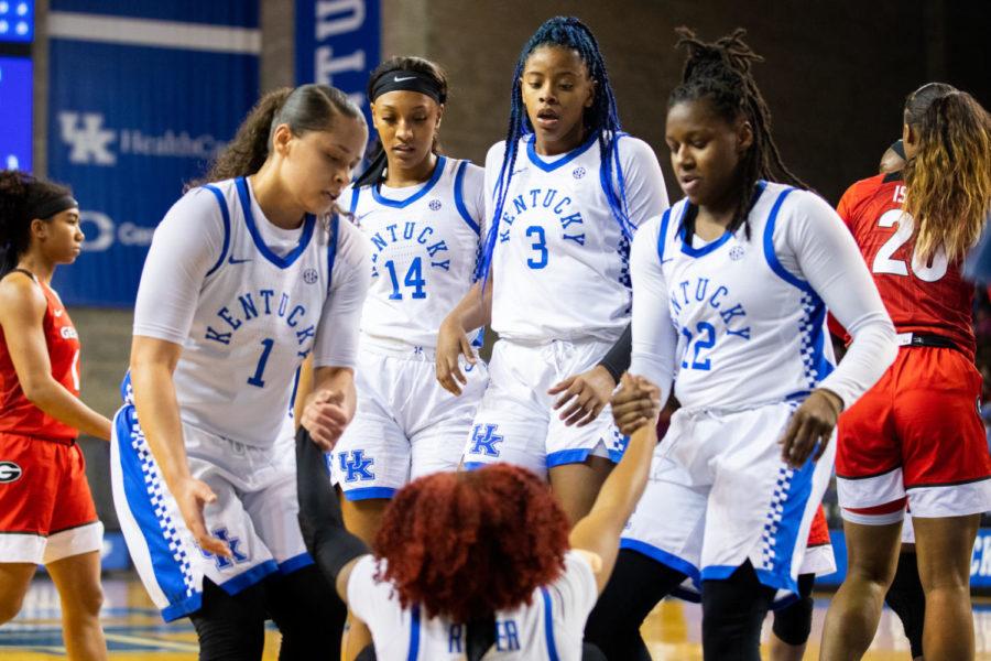 Kentucky senior guard Jaida Roper is helped off of the ground by her teammates during the University of Kentucky vs. Georgia womens basketball senior night game on Thursday, Feb. 27, 2020, at Memorial Coliseum in Lexington, Kentucky. UK won 88-77. Photo by Michael Clubb | Staff