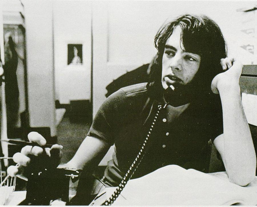Sports editor Mike Tierney answers the phone in the Kernel officee. | 1972 KENTUCKIAN