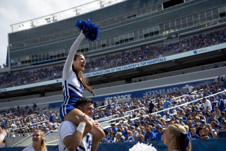 A cheerleader leads the crowd in a cheer during the game against Central Michigan on Saturday Sept. 1, 2018, at Kroger Field in Lexington, Kentucky. Kentucky won 35-20. Photo by Arden Barnes | Staff
