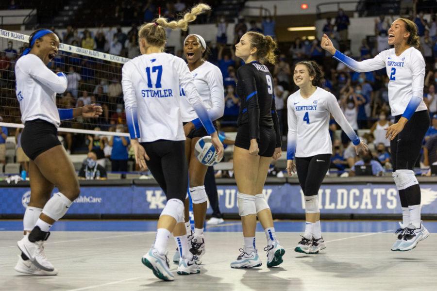 The Wildcats celebrate during UK volleyball’s game against Southern California on Saturday, Sept. 4, 2021, at Memorial Coliseum in Lexington, Kentucky. UK won 3-0. Photo by Jack Weaver | Staff