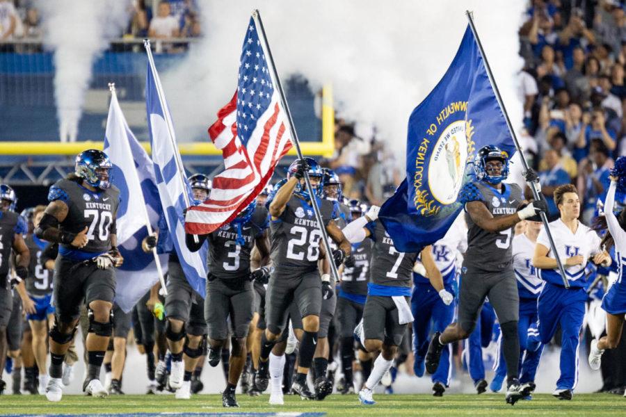 The Wildcats run onto the field before the No. 16 University of Kentucky vs. LSU game on Saturday, Oct. 9, 2021, at Kroger Field in Lexington, Kentucky. UK won 42-21. Photo by Jack Weaver | Staff