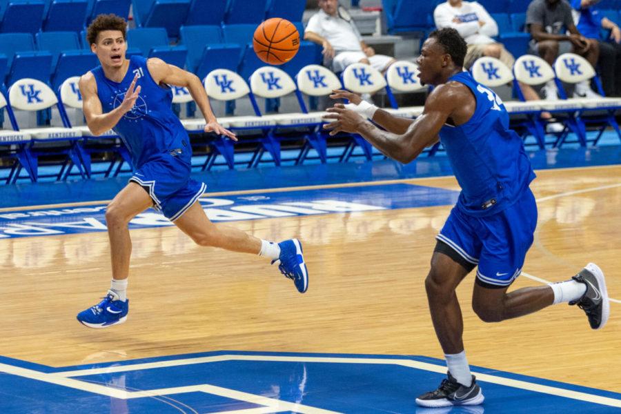 Kentucky forward Oscar Tshiebwe (34) passes the ball to Kentucky guard Kellan Grady (31) during a practice on Monday, Oct. 11, 2021, at Rupp Arena in Lexington, Kentucky. Photo by Jack Weaver | Staff