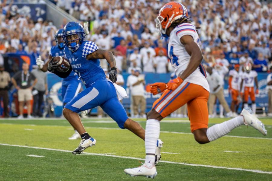 Kentucky wide receiver WanDale Robinson (1) looks back at a defender before scoring during the University of Kentucky vs. Florida football game on Saturday, Oct. 2, 2021, at Kroger Field in Lexington, Kentucky. Photo by Jack Weaver | Staff