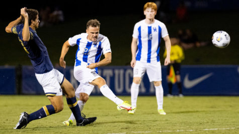 Kentucky Wildcats midfielder Nick Gutmann (21) kicks the ball into the box during the University of Kentucky vs. Notre Dame mens soccer game on Friday, Sept. 3, 2021, at the Bell Soccer Complex in Lexington, Kentucky. UK won 1-0. Photo by Michael Clubb | Staff
