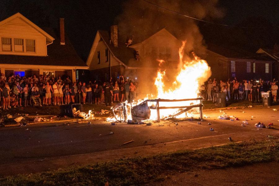 A+table+burns+during+a+student+celebration+after+Kentucky+football+defeated+No.+10+Florida+on+Saturday%2C+Oct.+2%2C+2021%2C+on+University+Avenue+in+Lexington%2C+Kentucky.+Photo+by+Jack+Weaver+%7C+Staff