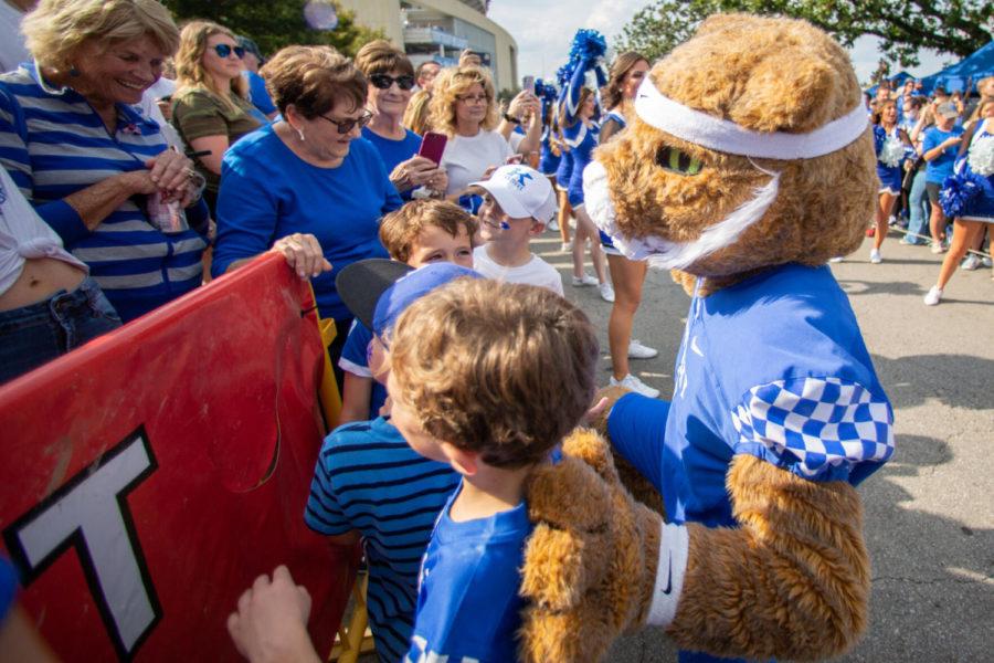 Young Kentucky fans pose for a photo with Wildcat during the University of Kentucky vs. Florida football game on Saturday, Oct. 2, 2021, at Kroger Field in Lexington, Kentucky. Photo by Jack Weaver | Staff