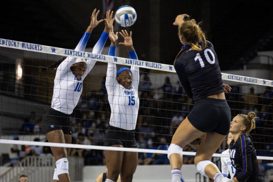 Kentucky Wildcats opposite Reagan Rutherford (10) and middle blocker Azhani Tealer (15) block the ball during UK’s home opener against Northern Iowa on Friday, Sept. 3, 2021, at Memorial Coliseum in Lexington, Kentucky. UK won 3-0. Photo by Jack Weaver | Staff